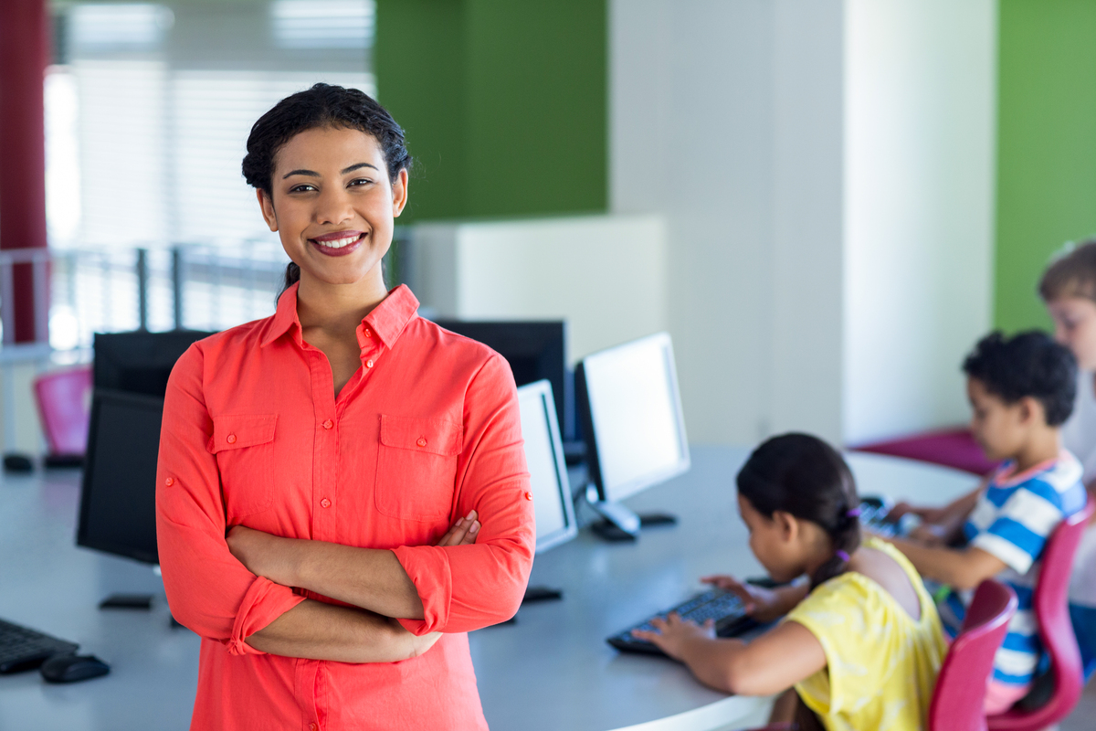 Female teacher facing the camera with a confident look