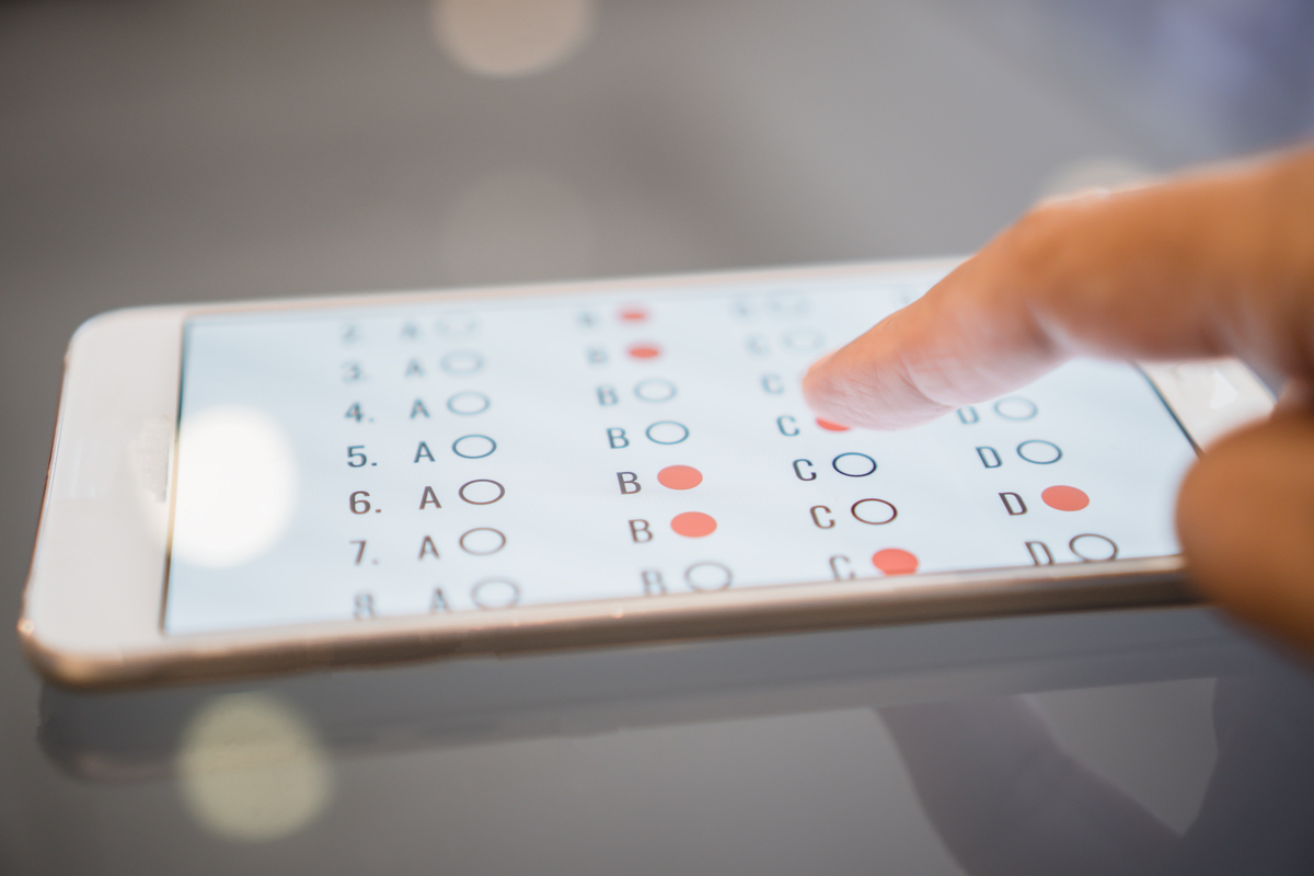 Person answering a survey on a mobile phone